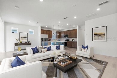 family opens to kitchen - virtually staged