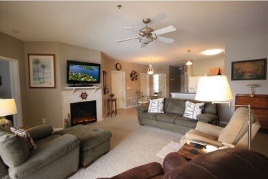 Living room features electric fireplace.