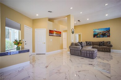 Living area featuring marble finish floor, recesse