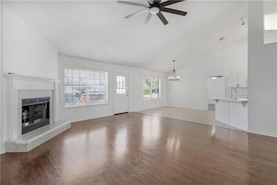 Unfurnished living room featuring ceiling fan with