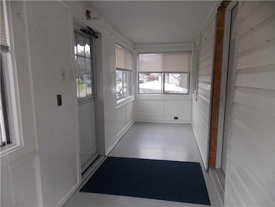 Exterior Front. Enclosed front porch