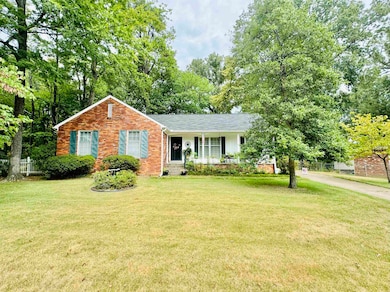 Single story home featuring a front lawn and cover