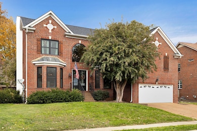 All brick home with mature landscaping and updated irrigation system