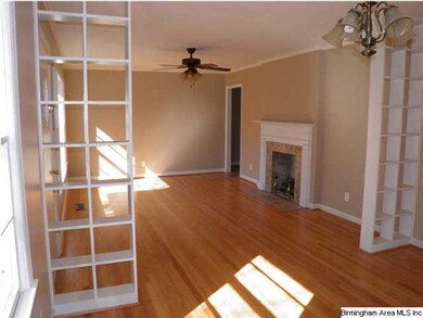 Attractive shelving separates the Living Room from