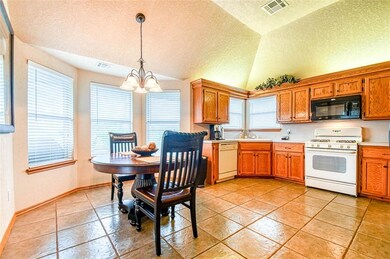 The kitchen and dining area offer a great view of 