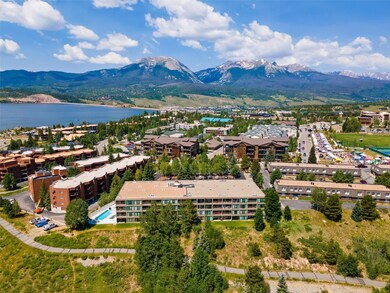 Drone / aerial view featuring a water and mountain