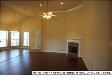 family room with 15 ft ceilings and wood floors
