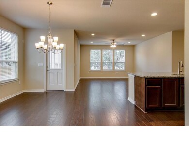 Kitchen featuring dark wood finished floors, a ch