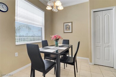 Dining area featuring light tile patterned floorin