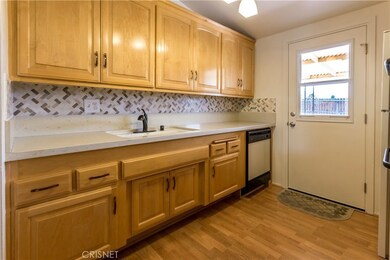 Kitchen leads to back yard. One of two ways to get to backyard.