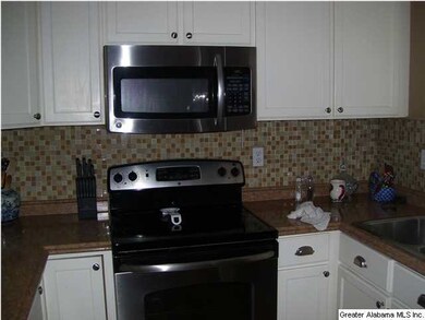 Kitchen with stainless steel appliances and hardwo