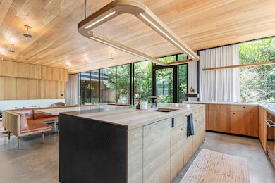 Kitchen featuring concrete floors, wood ceiling, 