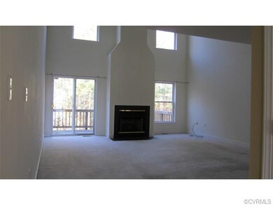 Huge light filled great room has vaulted ceiling t