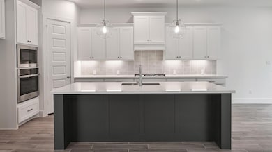 Kitchen with a sink, decorative backsplash, wood 