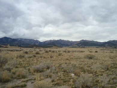 View of mountain backdrop featuring rural landscape