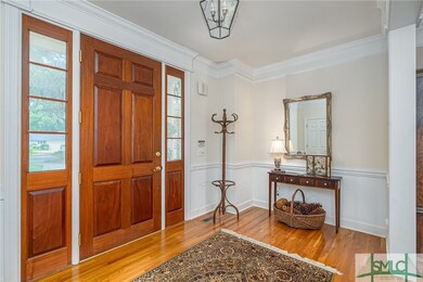 The spacious entry welcomes you into this fine hom