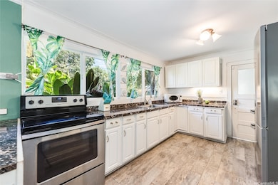 Spacious kitchen with lots of cabinet space.