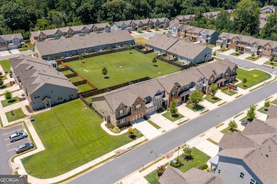 Shows grassy area to the left of the property and behind the unit. Best lot in the community!