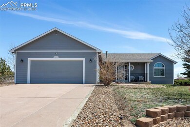 Single story home with a garage and covered porch