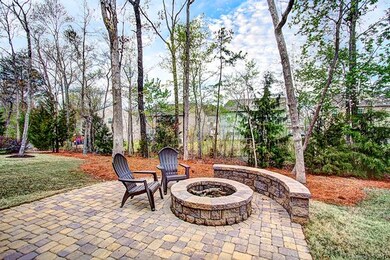 Relax on your patio with the fire pit and wooded y
