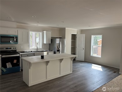 Kitchen with Large Island, Dining Area and Pantry