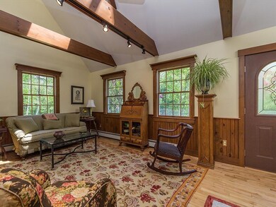 Bright living room with cathedral...