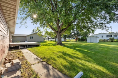 Great back yard! With storage shed, deck and mature trees.