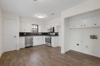 Kitchen featuring appliances with stainless steel 