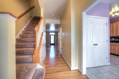 From front door, steps to upstairs on right, washe