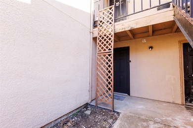 View of exterior entry with stucco siding