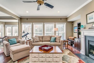 All your friends can enjoy the big game in your spacious great room with a wall of windows overlooking your fenced yard.