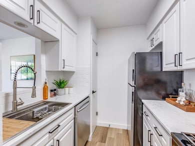 Kitchen featuring appliances with stainless steel