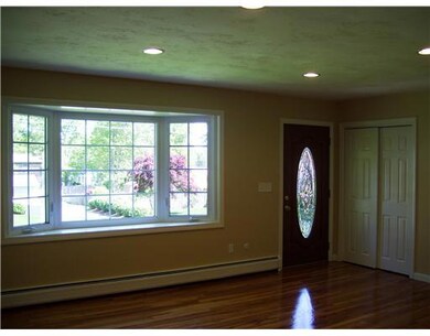 Living Room. 18x15 LR offers a brick FP,  Re-finis