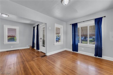 Empty room featuring hardwood / wood-style floors and plenty of natural light