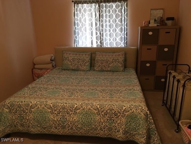 Bedroom with carpet flooring