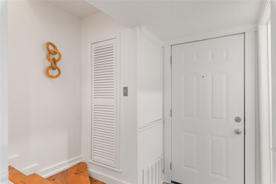 Hallway with baseboards and wood finished floors