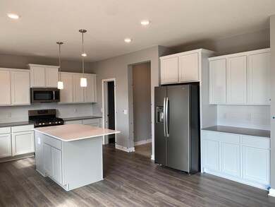 A reverse look at the kitchen. The Mud room seamlessly connects to the kitchen which makes unpacking the groceries a breeze.(Model photo)