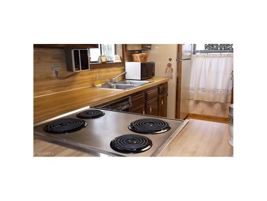 Kitchen has plenty of counter space for a busy cook.  All appliances stay.