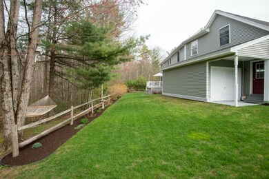 Back yard view, manicured lawn and...