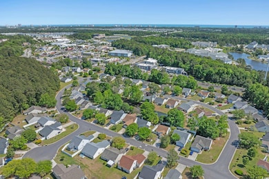 Bird's eye view featuring a water view and a resid