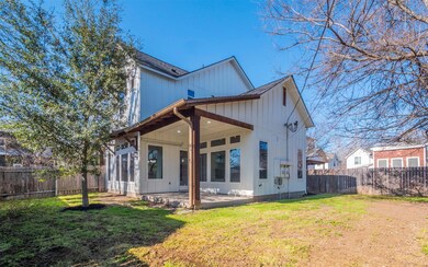 Back of property featuring a patio area, a fenced