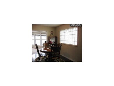 Formal Dining Room with artistic designed glass wi