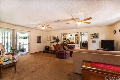 living #2 in back of house with entry to back mast