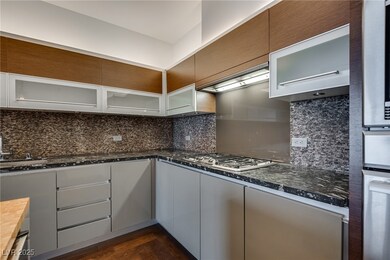 Kitchen with glass insert cabinets, stainless stee