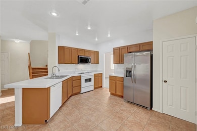 Kitchen featuring appliances with stainless steel