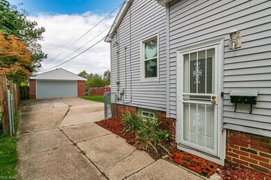 Driveway opens up to allow for additional parking,