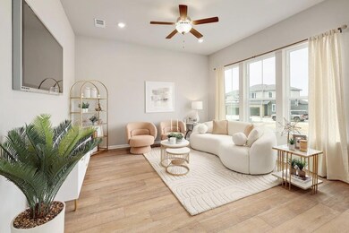 Living area featuring light wood-style floors, a 