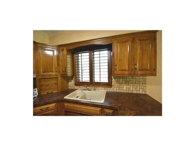 Wood Shutters on many windows.