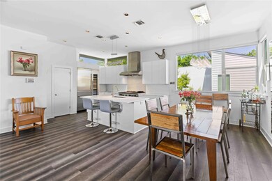 Dining space with baseboards, dark wood-type floo