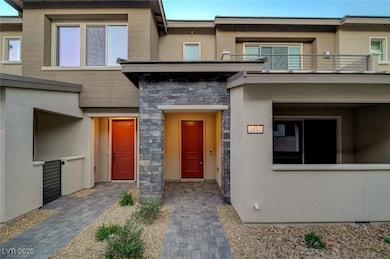 Entrance to property featuring stucco siding, ston